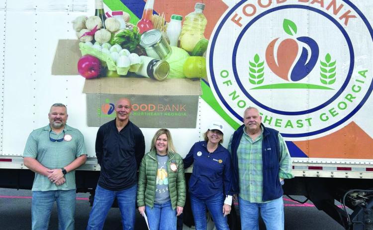 Submitted photo. The Rotary Impact Club of Clayton recently organized a food and fund drive for the Food Bank of Northeast Georgia where 4,836 pounds of food and $1,724 in donations were raised. Pictured are Kyle Shook; James Brim, Food Bank of Northeast Georgia Mountain Branch director; Sonya Shook; Amy Hulett; and Jon Tuck, president of the Rotary Impact Club of Clayton.