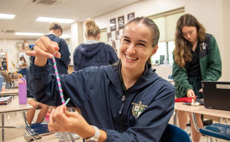 Photos courtesy Tallulah Falls School. Megan Prince creates bracelets for hospital care packages through the National Honor Society. She logged more than 26 service hours during the fall semester.