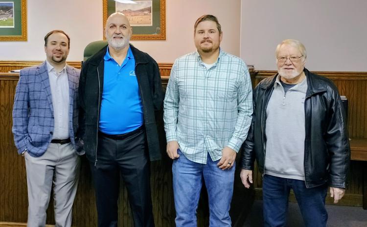 Megan Horn/The Clayton Tribune. The Clayton City Council will see new faces in 2026 after newly elected Channing Watts and Colt Woodall both took the Oath of Office to be official council members. Pictured are Woodall, Post 2 council member, left; Mayor Roy Quilliams; Watts, Post 1 council member; and incumbent Council Member Tony Allen.