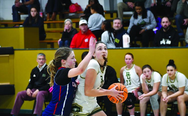 Wesley Branch/The Clayton Tribune. Rabun Gap senior Lydia McNabb fights off a Carolina Day defender in Rabun Gap’s 59-27 win over Carolina Day on Jan. 8. The Lady Eagles had over three weeks in between games due to the holiday break.
