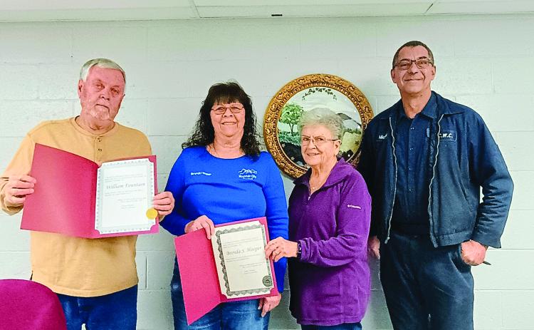 Megan Horn/The Clayton Tribune. The City of Mountain City council includes Bill Fountain, left; Brenda Hooper; Mayor Grace Watts; Michael Holt and Eric McCrackin (not pictured). Fountain and Hooper hold up official documents from Tammy Whitmire, director of elections, certifying their wins in the Nov. 4, 2025, General Election. Fountain was elected to the Post 3 Council Member seat while Hooper was re-elected to the Post 2 Council Member seat after running unopposed.