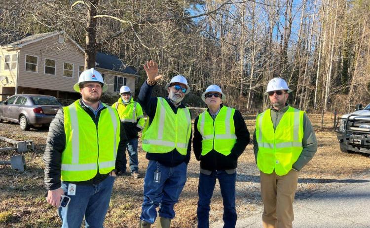 Photos courtesy Rep. Andrew Clyde’s Office. U.S. Rep. Andrew Clyde (second from right) gets a firsthand look at Georgia Power’s restoration efforts.