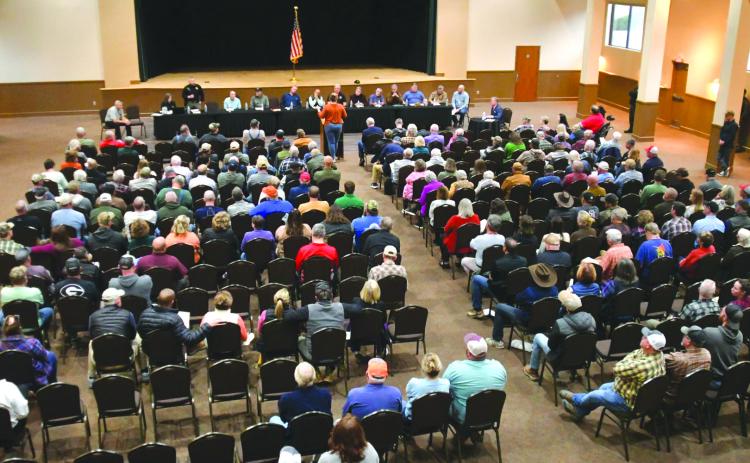 Enoch Autry/The Clayton Tribune. The seats inside the Rabun County Civic Center were filled on Tuesday for a county town hall meeting about building codes and citations. Along the walls of the room, more people stood to listen at the event.