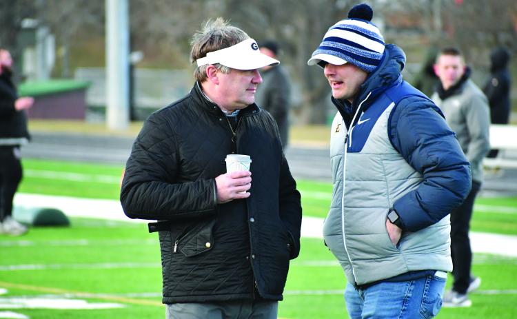 Wesley Branch/The Clayton Tribune. Georgia head football coach Kirby Smart and East Tennessee State head football coach Will Healy talk during the Rabun Gap College Coaches Social on Jan. 28. Multiple players in attendance received a scholarship offer from Georgia following the event, and Rabun Gap’s Jaxon Totherow received an offer from ETSU, marking his first Division I offer.