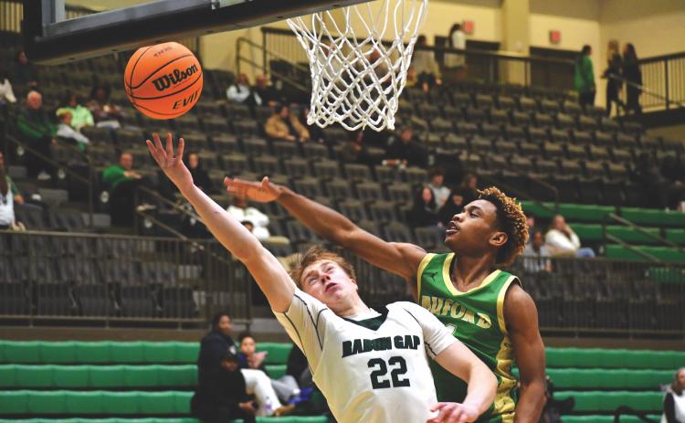 Wesley Branch/The Clayton Tribune. Rabun Gap-Nacoochee School junior Joonatan Tartu fights through the Buford defense for an and-one layup in Rabun Gap’s 61-56 win over Buford on Jan. 30. Tartu converted the and-one pictured above and made an important block late in the game in the Eagles’ victory.