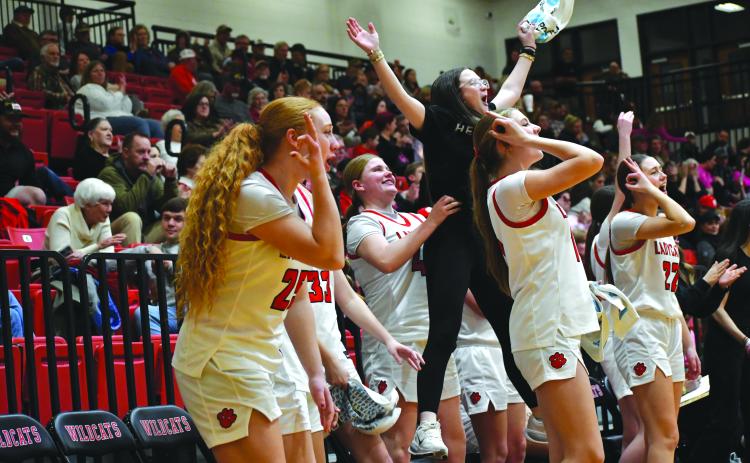 Wesley Branch/The Clayton Tribune. The Rabun County bench erupts after a made 3-pointer in the Lady Cats’ 68-26 win over Commerce on Feb. 12. The Lady Cats are the No. 1 seed in this week’s region tourney, being played at Piedmont University.