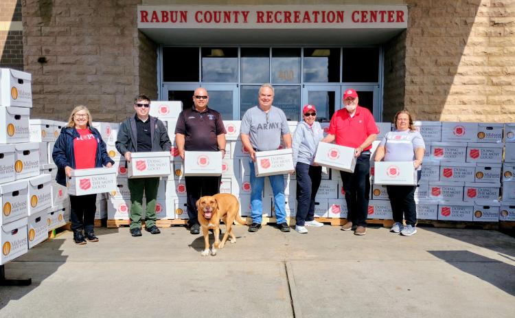 Pictured are Lanita Lloyd,The Salvation Army divisional Emergency Disaster Services (EDS) director for Georgia, left; Jonathan Jones, Georgia Emergency Management Agency (GEMA) Area 1 Field coordinator; Brian Panell, Rabun County EMA Director; Rabun County Commissioner Kent Woerner with his dog named “New Dog;” The Salvation Army volunteers Marsha Kaufmann and Jim Kaufmann; and Cindy Puryear, The Salvation Army divisional Emergency Disaster Services (EDS) assistant director for Georgia.