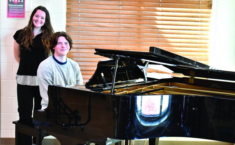 Megan Horn/The Clayton Tribune. Choir Teacher Tessa Backer, left, was selected as the 2025-2026 STAR Teacher by STAR Student Gavin Sharpe, who sits at the piano. Sharpe enjoys playing the piano and composing music, and said Backer has been an influential role model for him in music.