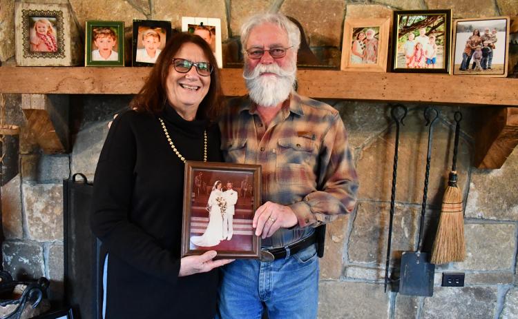 Megan Horn/The Clayton Tribune. Joe and Angela Luke have been married for 46 years and say they are “best friends.” Respecting one another is a key to their successful marriage along with their strong faith. They are pictured holding a photo from their wedding day on May 19, 1979, in Pompano Beach, Fla.