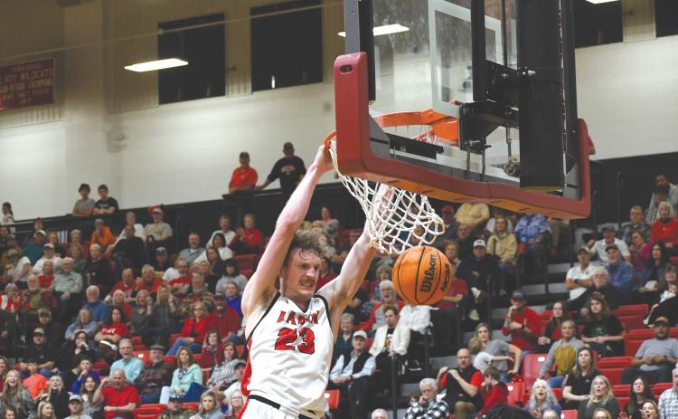 Wesley Branch/The Clayton Tribune. Rabun County senior Hayes Free throws down a powerful dunk in the Wildcats’ 84-52 win over Heard County Feb. 28 in the GHSA state playoffs. Free and the Wildcats have set a school season record with 27 wins.