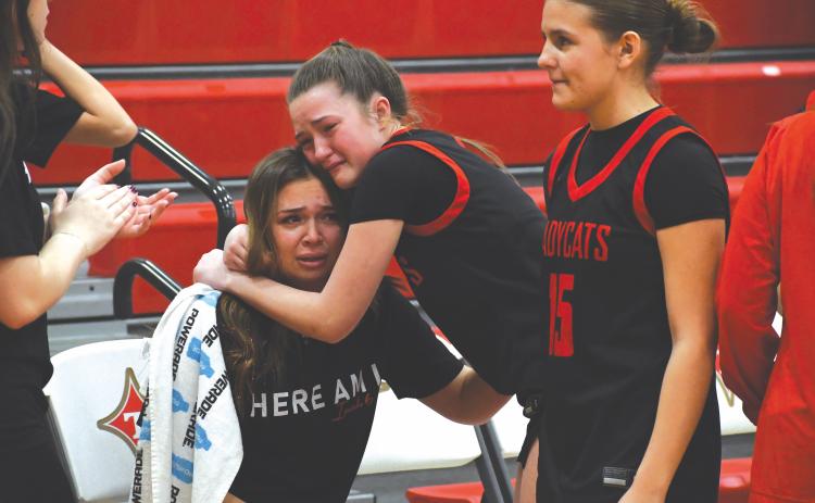 Wesley Branch/The Clayton Tribune. Rabun County sophomore Maci Dixon consoles Rabun County senior Loren Mazarky after the Lady Cats’ 46-44 loss to Thomasville in the Elite Eight on March 3 at Thomasville High School. Mazarky is one of five senior players for the Lady Cats.
