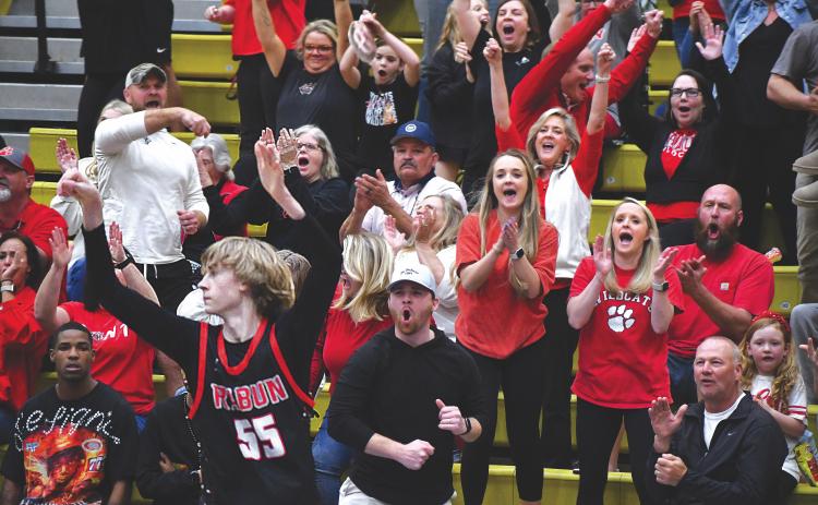 Wesley Branch/The Clayton Tribune. The Rabun County crowd celebrates after a made 3-pointer by Wildcat freshman Trace Adcock late in the fourth quarter of their 70-59 win over Fitzgerald in the Final Four on March 7 at Fort Valley State University. Adcock ranks No. 21 in the country in made 3-pointers this season according to MaxPreps.