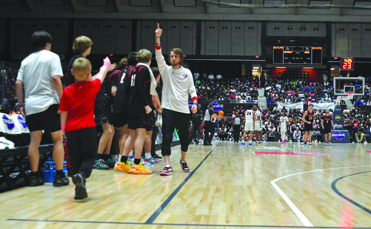 Enoch Autry/The Clayton Tribune. In the first half of the Wildcats’ state championship game in the Macon Coliseum, head coach David Adcock signals the No. 1. The boys basketball team would conclude the 2025-2026 season with the top ranking after rolling to a 30-2 record and the Class A Division I title.