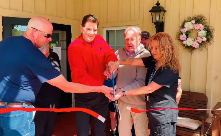 Photo courtesy of Forward Rabun/Rabun County Chamber of Commerce.  Community members and the Majors celebrate the 20th anniversary on Cannonwood Retirement Home in Tiger. The Majors also own the Tiger Drive-In which is next door to Cannonwood.