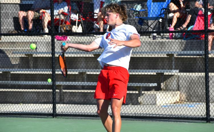 Wesley Branch/The Clayton Tribune. Rabun County junior Landan Bedingfield prepares to strike the ball in Bedingfield and Brady Darnell’s doubles match on April 15 at Victory Lord Park in Winder, Ga., in the region tournament championship versus Athens Academy. Bedingfield and Darnell defeated the Spartans’ duo of  Price West and Jack Roberts, who were undefeated going into the match.