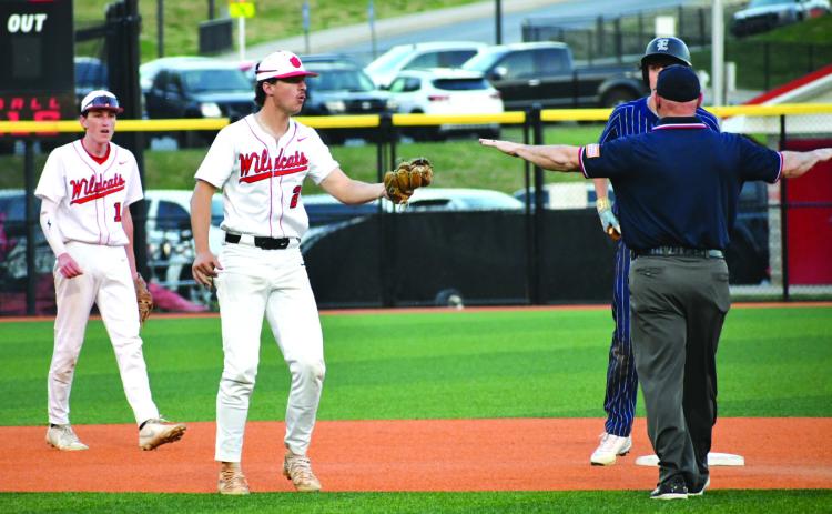 Enoch Autry/The Clayton Tribune. Senior second baseman Ty Truelove tries to convince the umpire he got the tag on Elbert County baserunner Brody Baker, but Baker is called safe in the Blue Devils’ 7-3 win over the Wildcats on March 31.
