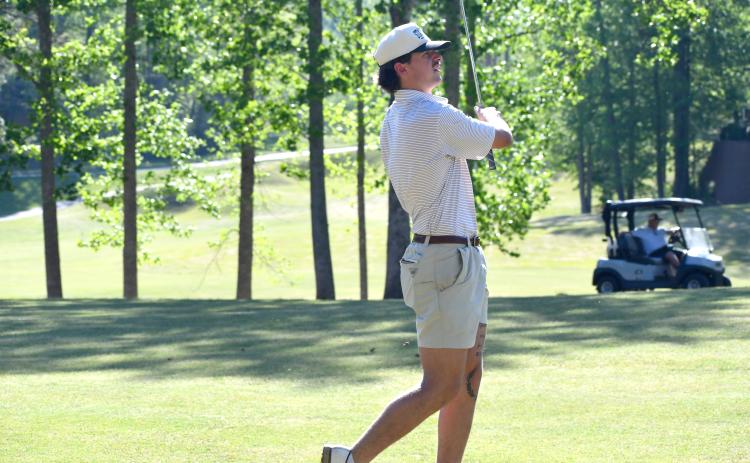 Wesley Branch/The Clayton Tribune. Rabun County senior Ty Truelove holds his follow through as he watches his shot during Rabun County’s golf match versus Union County on April 16 at Kingwood Resort. Truelove shot a season best 38 on the afternoon.