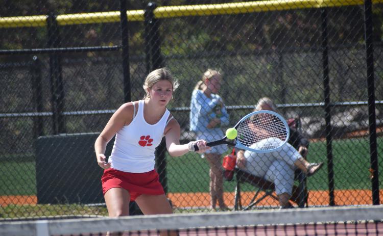 Wesley Branch/The Clayton Tribune. Rabun County’s Mia Potts loads up to strike the ball in her singles match against Dodge County on April 21 at Rabun County High School. Potts secured the match-clinching victory by winning her singles match on No. 2 singles.