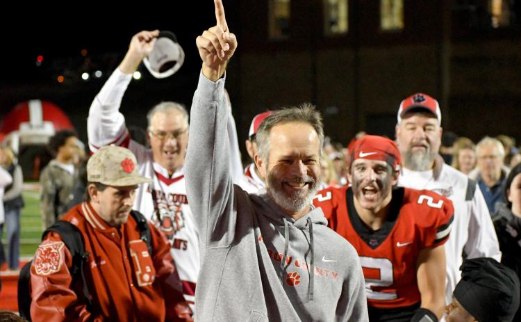 Wesley Branch/The Clayton Tribune. RCHS head football coach Ranch Gillespie celebrates with his team following the Wildcats’ 35-0 playoff win over Berrien County on Nov. 21. The Future Wildcat Kids Camp is set for May 18-19 at the stadium.