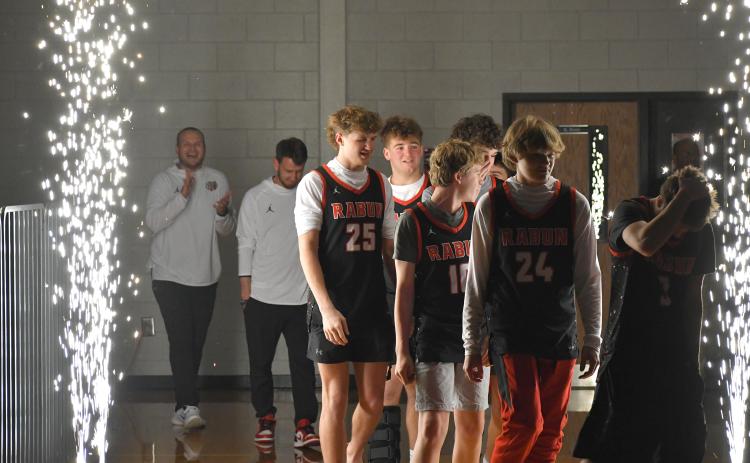 Wesley Branch/The Clayton Tribune. The Rabun County High School basketball team walks onto the floor for its championship celebration on RCHS’ campus on March 26.