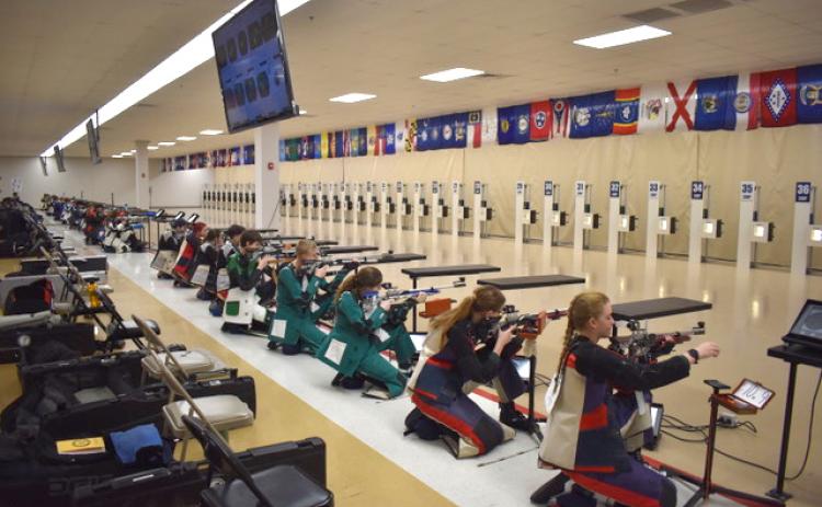 Submitted photo. Rifle team members including Tallulah Falls (center) take aim at in the regional championship in Alabama.