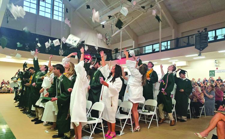 Enoch Autry/The Clayton Tribune.  The graduating class of the Tallulah Falls School toss their caps into the air at the conclusion of the May 22 commencement inside the TFS Lower/Middle School Campus Activity Center. 