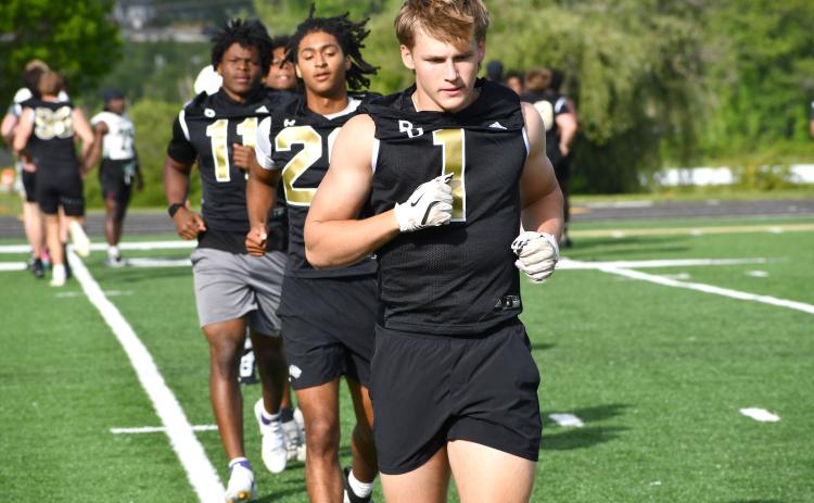 Wesley Branch/The Clayton Tribune. Rabun Gap Class of 2028 linebacker Jay Schell warms up for Rabun Gap’s May 7 college coaches social. Schell has 36 Division I offers, with LSU most recently offering him a scholarship.