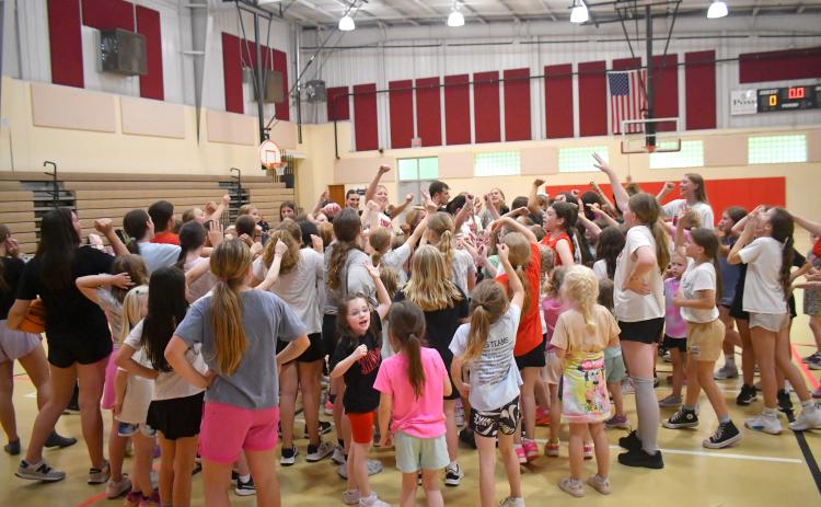 Wesley Branch/The Clayton Tribune. The Rabun County Lady Cat players, coaches and campers wrap up day one of Lady Cats basketball camp on May 11 at the Rabun County Recreation Department. Over 100 campers were in attendance during the week.
