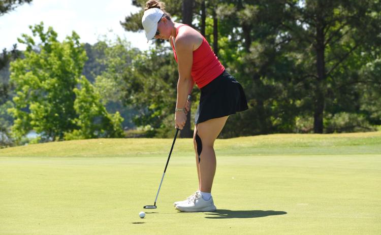 Wesley Branch/The Clayton Tribune. Rabun County sophomore Bella Hulsey follows through on a putt at the Class A Division I state championship on May 18 at Arrowhead Pointe Golf Course in Elberton. Hulsey shot a team-best 190 at the 36-hole tournament. 