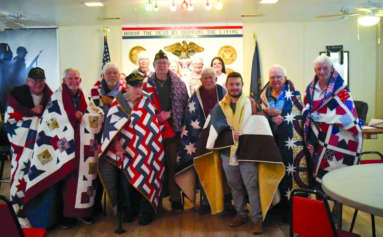 Enoch Autry/The Clayton Tribune. Nine veterans were in attendance at Veterans of Foreign Wars Post 4570 on June 19 to receive Quilts of Valor as each of the quilts took approximately 200 hours to stitch.