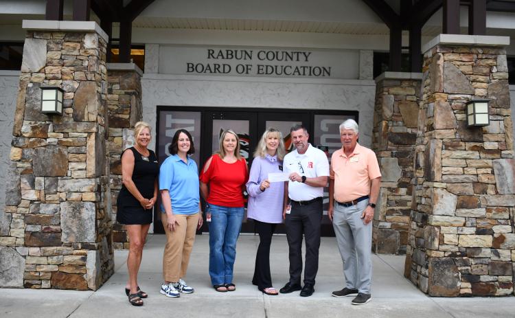 Megan Horn/The Clayton Tribune. Pictured are Rotary Club of Clayton President-Elect Laura Seberg, left; Katie Grady,  executive director of Camp Evergreen; Kelly McKay, assistant superintendent for Rabun County Schools; Karen Bacon, Rotary Club of Clayton Foundation chair; Steven Cole, superintendent of Rabun County Schools; and Matt Freeman, Rotary Club of Clayton President.