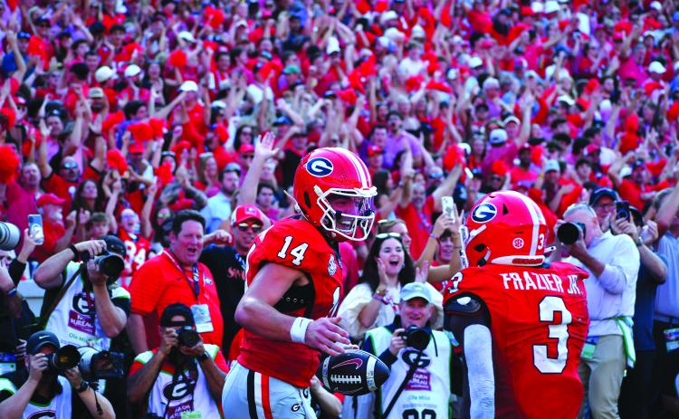 Wesley Branch/The Clayton Tribune. Former Rabun County and current UGA quarterback Gunner Stockton celebrates with teammate Nate Frazier after scoring a rushing touchdown during Georgia’s 43-35 win over Ole Miss at Sanford Stadium on Oct. 18, 2025. Stockton said at SEC Media Days on July 21 that his goal for his final season of college football is to “make memories.” Stockton and the Bulldogs will open the new season on Sept. 5 at home versus Tennessee State. 