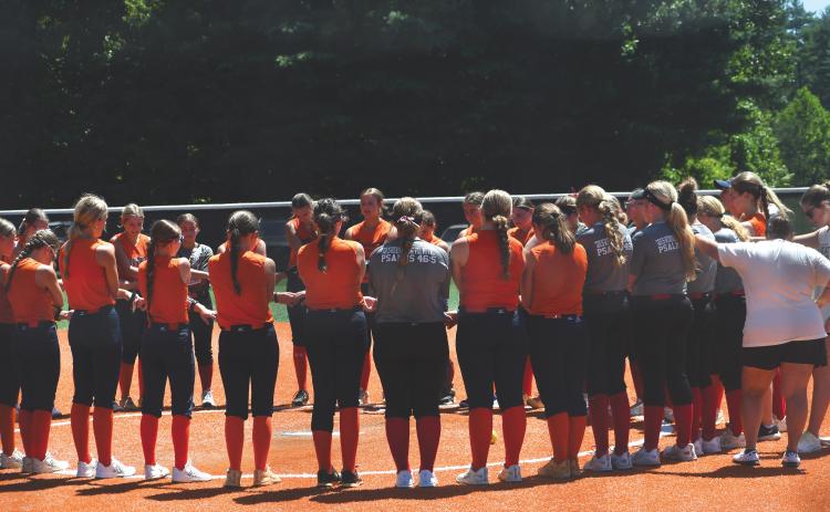 Wesley Branch/The Clayton Tribune. Rabun County and Habersham Central players gather to pray together after the teams completed their July 20 scrimmage at Rabun County High School. The Lady Cats are led by third-year head coach Jessica Evans.
