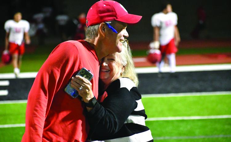 Wesley Branch/The Clayton Tribune. Rabun County head football coach Rance Gillespie (left) hugs his mother Glenda Rogers after Rabun County’s “Midnight Madness” practice. Gillespie is heading into his second year as Rabun County’s head football coach. 