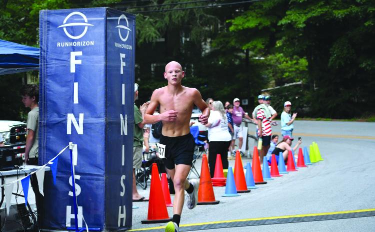 Enoch Autry/The Clayton Tribune. Andrew Wall, 15, wins the Rabun Ramble 5K on Independence Day in Lakemont. Wall is a rising sophomore at Rabun County High School.