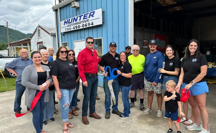 Photo courtesy of Forward Rabun/Rabun County Chamber of Commerce. The ribbon is cut for Hunter Automotive in Clayton for the business’ grand opening on July 10.