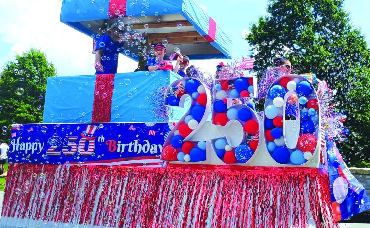 Megan Horn/The Clayton Tribune. This “Present of Freedom” float by O.L.I. Home Solutions was the parade winner in the Sky Valley Independence Day grand parade on Friday, July 3. The day was filled with fun, food and a fireworks show.