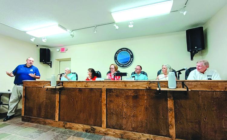 Megan Horn/The Clayton Tribune. Sky Valley City Manager Jason Streetman, left, gives his last report as city manager at the July 21 regular council meeting. Pictured right are Council Member Tony Allred, Council President Beth Pence, Mayor Benita Cotton-Orr, and council members Jesse Price, CareySue Beasley and Jim Curtis. Streetman’s last day as Sky Valley’s city manager is July 31. His start date as Clarkesville city manager is Aug. 3. 