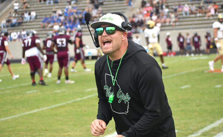 Wesley Branch/The Clayton Tribune. Rabun Gap head football coach Derek White directs his team on the sideline during Rabun Gap’s Aug. 14 scrimmage versus Westside (S.C.). RGNS will face Venice (Fla.) on Aug. 21 at home to open the season. 