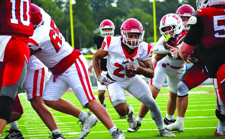 Enoch Autry/The Clayton Tribune. Rabun County sophomore running back Amir Thompson goes up the middle in the second half of the scrimmage against Franklin for a touchdown. The score was set up by multiple runs by senior running back JK Fruster. The Wildcats open their regular season on Aug. 28 at home against Metter.