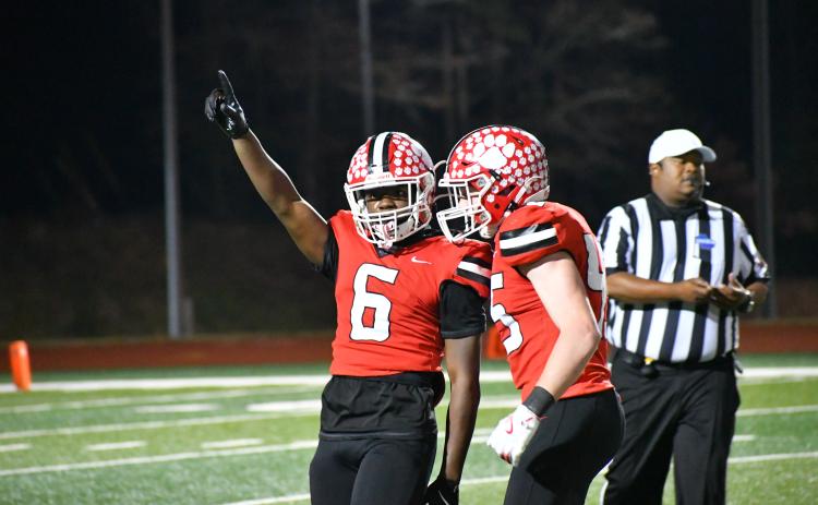 Wesley Branch/The Clayton Tribune. Rabun County’s JK Fruster (left) and Mack Williams celebrate after a sack by Fruster during the Wildcats’ second-round home playoff win over Berrien on Nov. 21, 2025. Fruster and Williams will headline the Wildcat defense this season. RCHS’s season opener is Aug. 28 at home.