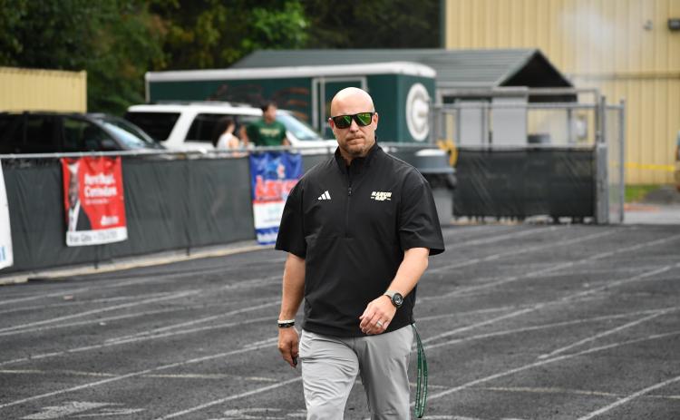 Wesley Branch/The Clayton Tribune. Rabun Gap head football coach Derek White walks to the field ahead of his team's game versus Grayson in 2025.