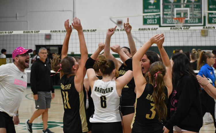 Wesley Branch/The Clayton Tribune. The Rabun Gap girls volleyball team celebrates its first-round playoff win versus Cannon School on Oct. 14, 2025.