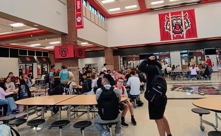 Megan Horn/The Clayton Tribune.  Rabun County middle and high school students mingle in the cafeteria on the first day of school Monday, Aug. 3. 