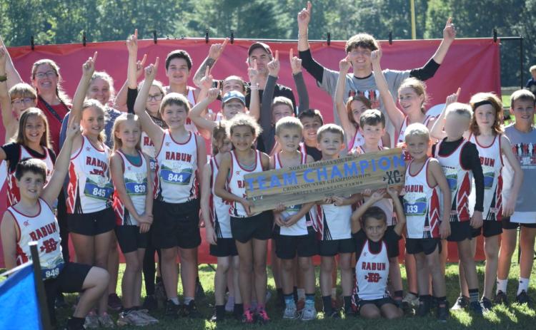 Submitted photo. Rabun County Recreation Department cross country runners celebrate their first-place team finish at Skitts Mountain Farm on Sept. 26. The team will complete on Oct. 3 at the state meet in Jefferson