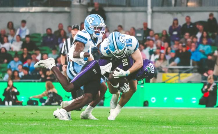Photo via Christian Proscia, NewEraPrep. Current North Carolina and former Rabun Gap defensive back Coleman Bryson (No. 16, center) makes a tackle on TCU wide receiver Jacobe Hayes during the Tar Heels’ 15-10 win over TCU on Aug. 29 in Ireland. Bryson finished the win with two tackles and a pass breakup.