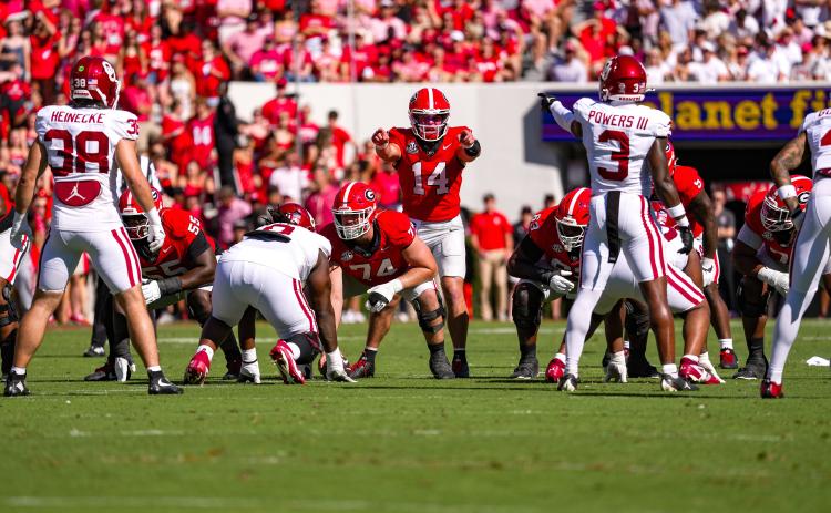 Tony Walsh/UGAAA. Former Rabun County and current UGA quarterback Gunner Stockton surveys the defense before a play in Georgia’s 41-13 win over Oklahoma on Sept. 26. Stockton completed 14-of-25 passes for 171 yards with a touchdown and an interception.