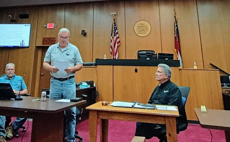 Megan Horn/The Clayton Tribune. Commissioner Kent Woerner reads aloud a proclamation supporting Rabun County Search and Rescue (SAR).
