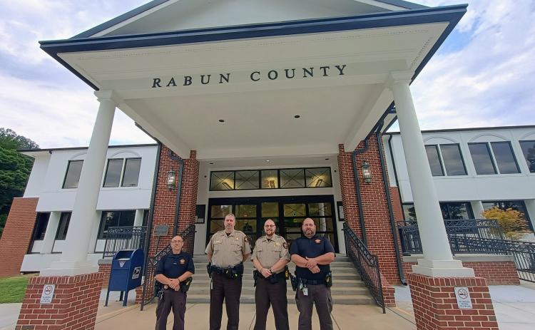 Megan Horn/The Clayton Tribune. The sheriff is mandated by law to provide the security of the Rabun County courthouse and the safety of superior court judges, magistrates, support staff and citizens who visit the county courthouse. The agency’s Judicial Process and Criminal Process Sections also serve in this division. Bailiffs pictured are Sgt. Tony Parrish, who oversees courthouse security, Steve Osborne, Daniel Nicholson and Joseph Silva.
