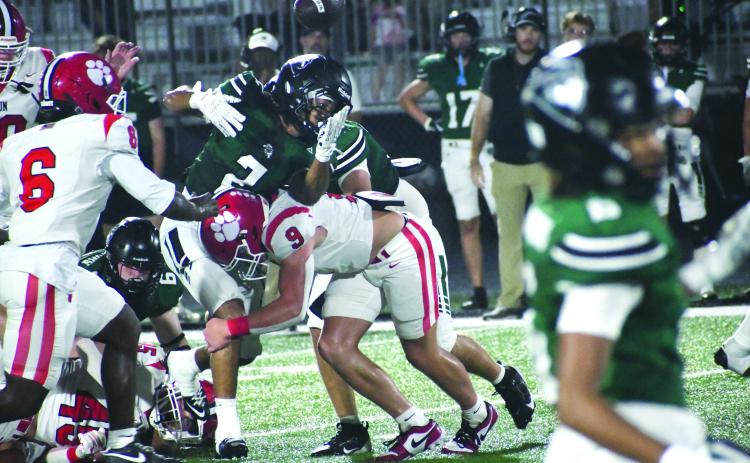 Wesley Branch/The Clayton Tribune. Rabun County linebacker Brock Brady forces a fumble from Walnut Grove’s Julian Sease during the Wildcats’ 17-3 loss to the Warriors on Sept. 11. Brady finished the game with 16 total tackles.